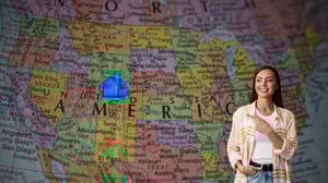 female designer in Florida pointing to house in Colorado